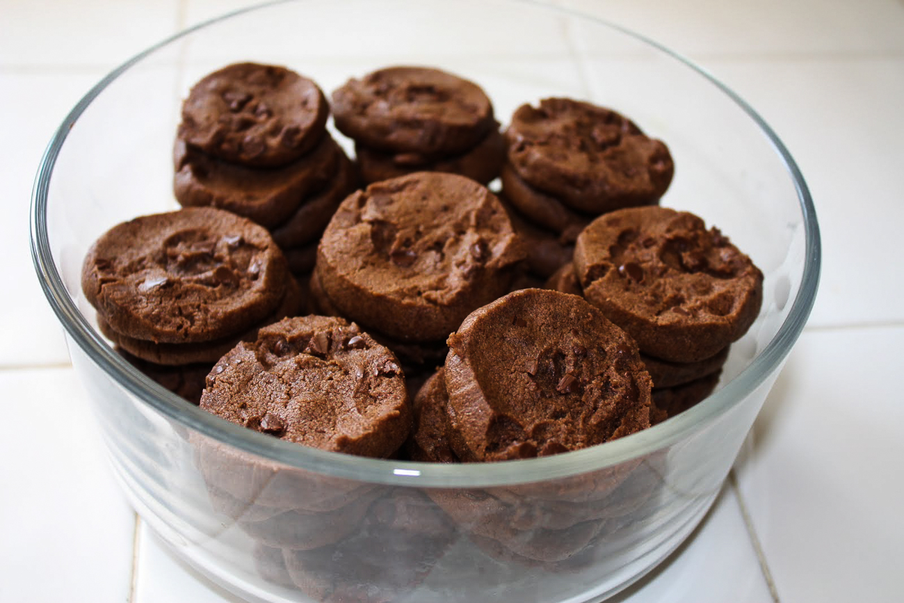 A glass container filled with freshly baked world peace cookies. 