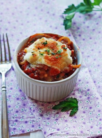 Easy spaghetti pie recipe baked in a ramekin and topped with ricotta and mozzarella cheeses.