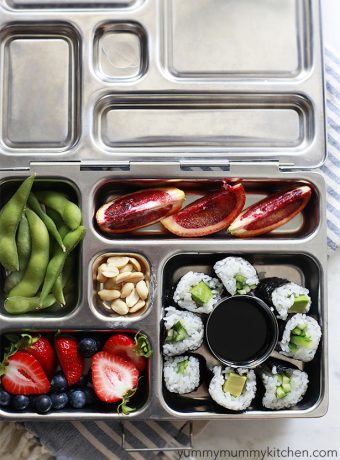 A healthy vegetarian and vegan kids' lunch in a planetbox with sushi.