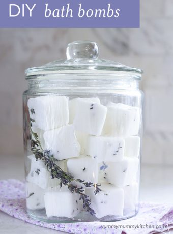 A glass canister filled with homemade lavender bath fizzies.