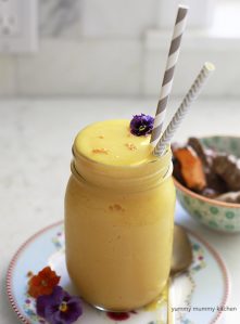 Bright orange tropical turmeric smoothie recipe.