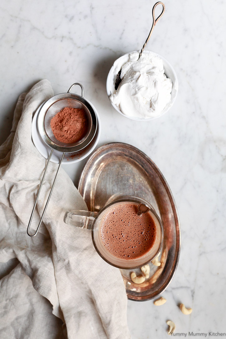 This easy vegan paleo hot chocolate is made with cashews and cacao and blended in the Vitamix. 