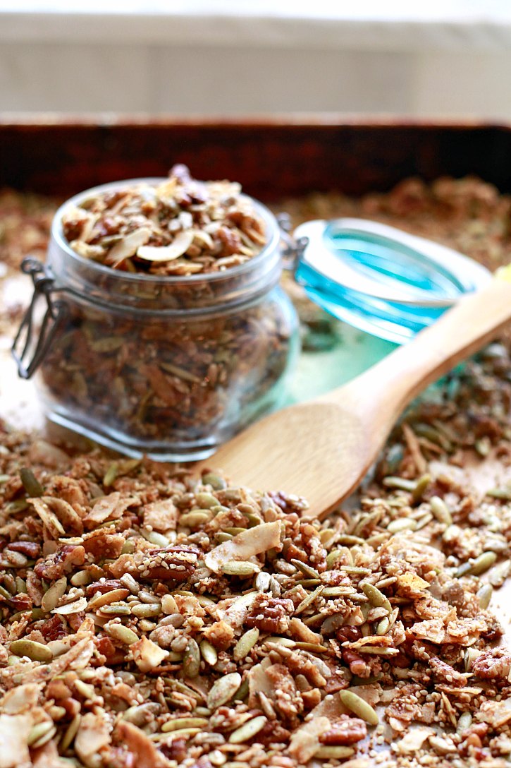 Making paleo, vegan, grain-free granola with seeds, nuts, and coconut oil is easy! Store it in a jar or give as a DIY gift.