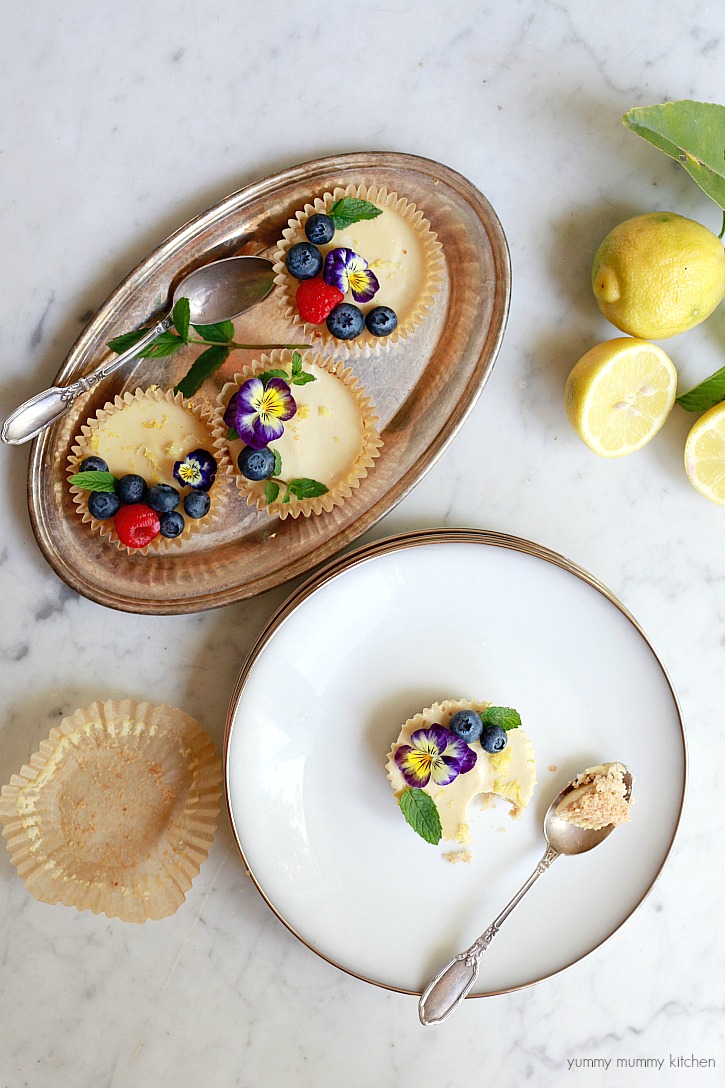 Beautiful paleo and vegan tarts topped with fruit and edible flowers. 
