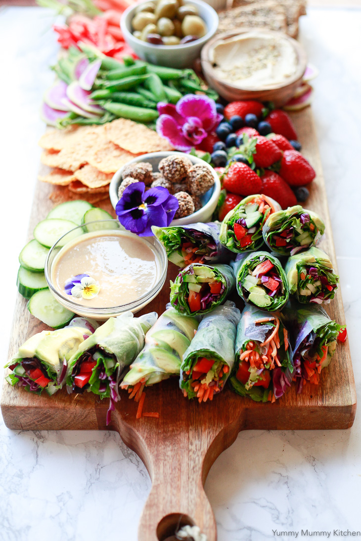 Colorful fresh homemade spring rolls served with peanut sauce are perfect on a party platter, for lunch, or a light dinner.