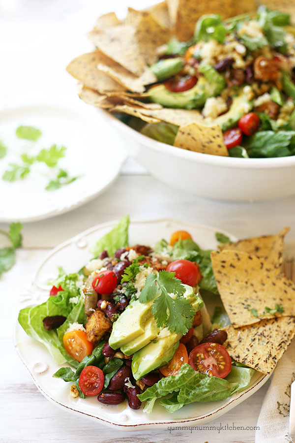 Beautiful vegetarian tempeh taco salad with avocado and flax chips. 