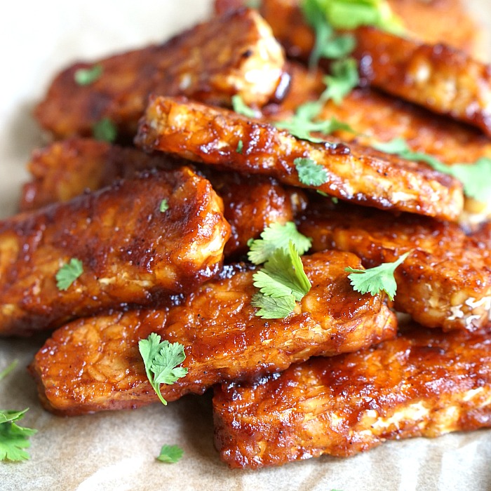 This easy BBQ baked tempeh recipe is delicious in sandwiches, wraps, or alone. 