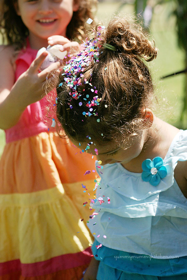 Girls cracking confetti eggs during Fiesta in Santa Barbara