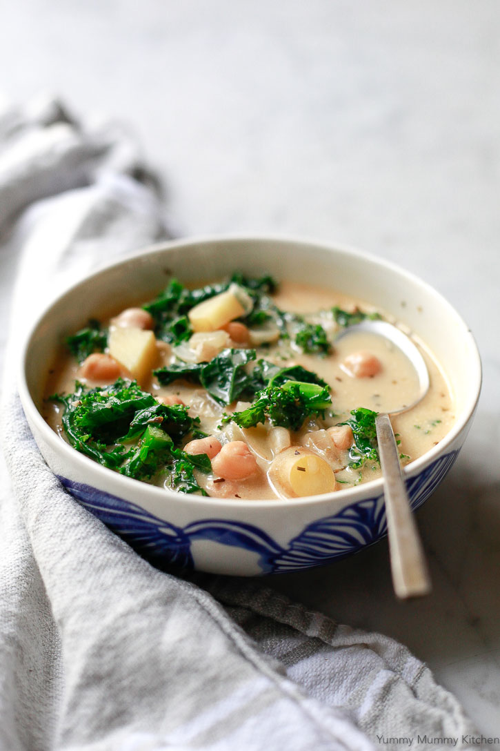 This Olive Garden inspired Zuppa Toscana soup recipe got a healthy vegan makeover. Loaded with kale, potatoes, and chickpeas, this hearty soup is and easy one-pot meal.