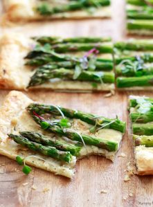 Beautiful square of asparagus tart made with puff pastry, fresh asparagus, and goat cheese.