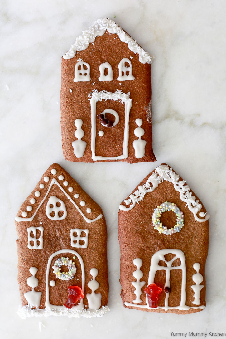 Gingerbread house cookies are a fun and easy alternative to making gingerbread houses. These are made with a gluten free, paleo, vegan almond flour gingerbread cookie dough. 