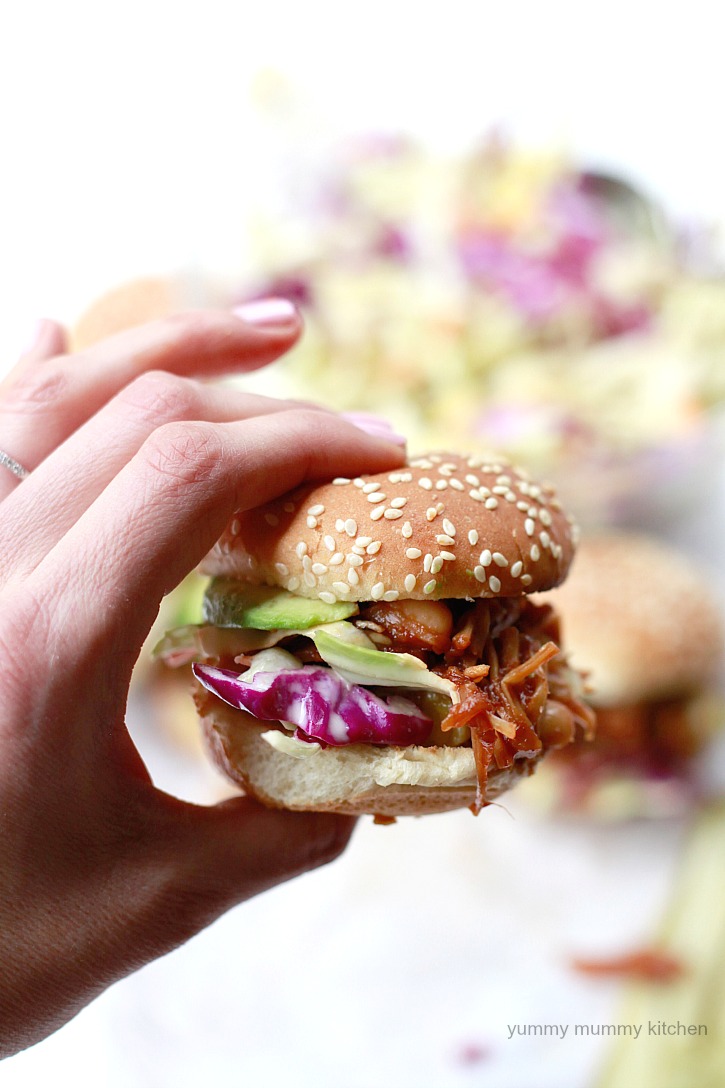 Easy BBQ pulled jackfruit and bean sandwiches made in the slow cooker or crockpot and served with slaw and avocado. These delicious jackfruit sandwiches are vegetarian and vegan. 