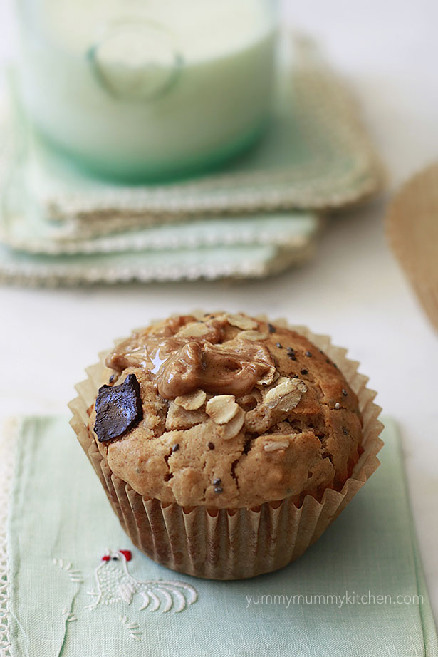 A healthy peanut butter oat muffin with chocolate chunks and chia seeds. 