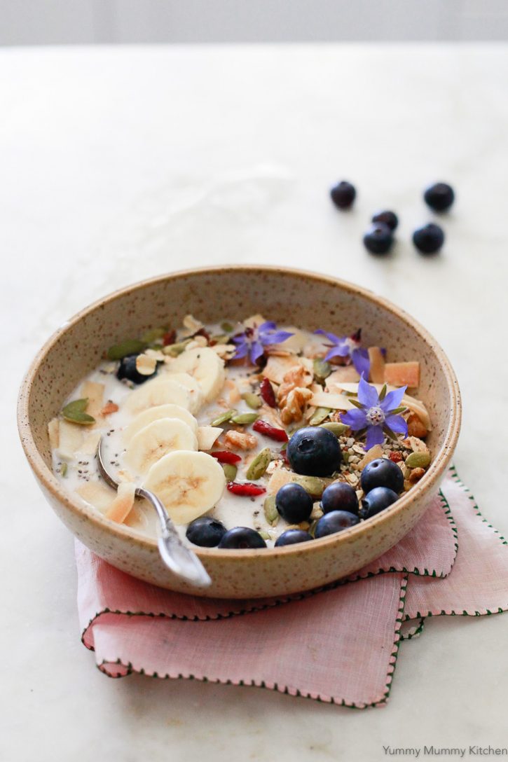 A bowl of superfood Bircher muesli with blueberries and almond milk makes a healthy vegan breakfast. 