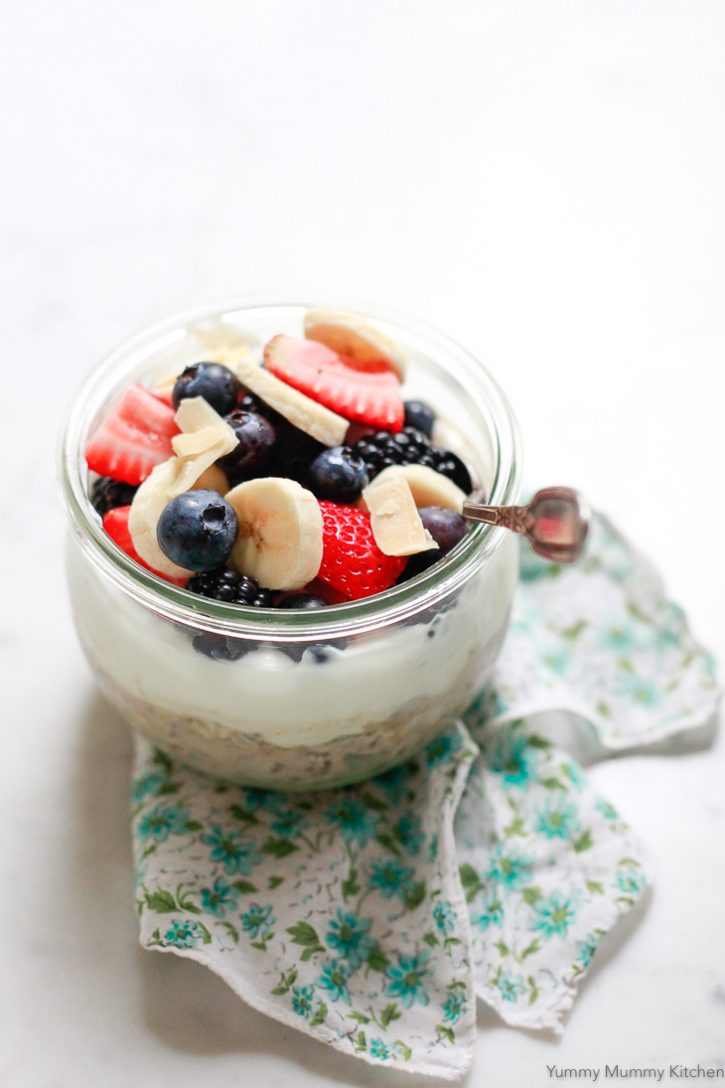 Soaked overnight muesli topped with yogurt, berries, and coconut is a healthy vegan breakfast in a jar. This easy muesli is a great on-the-go jar breakfast. 