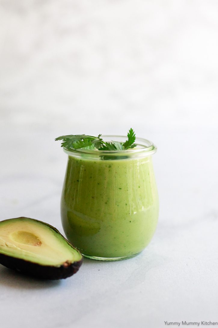 Green avocado salad dressing in a jar. This easy homemade avocado dressing is so flavorful and easy to make. It's naturally vegan and gluten-free. 