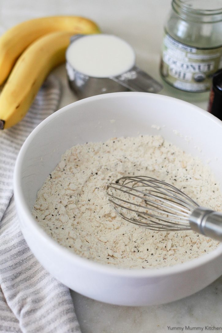 Dry ingredients get whisked together for vegan banana pancakes. 