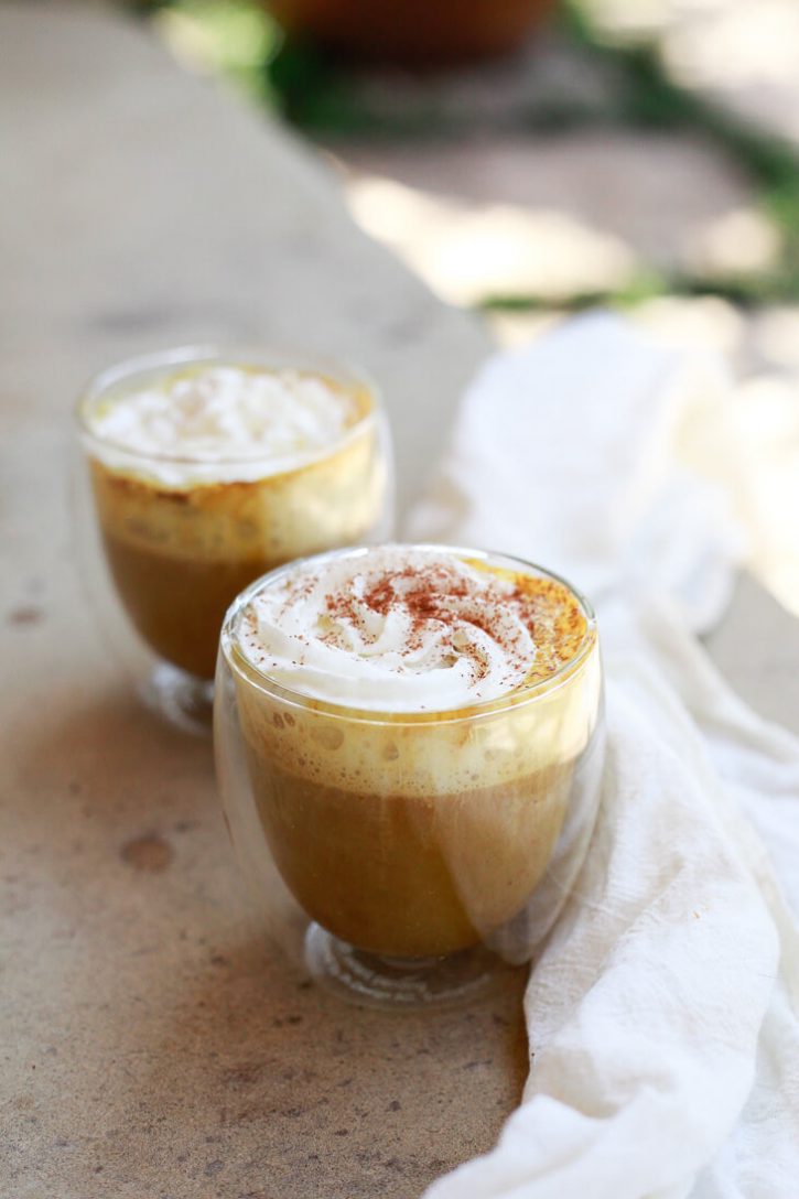 Homemade pumpkin spice lattes in clear insulated glass coffee tumblers. This delicious vegan pumpkin spice latte recipe is so easy and healthy. 