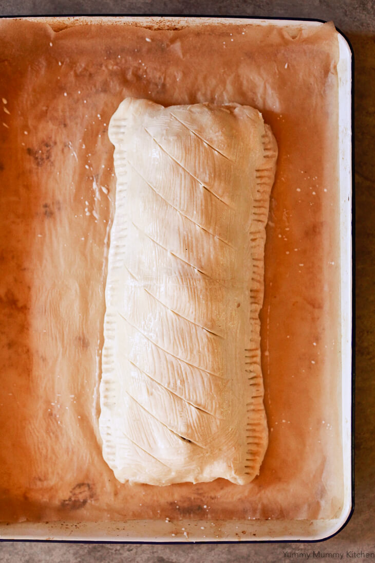 Puff pastry Vegetarian Wellington is brushed with coconut milk and scored before going into the oven. 