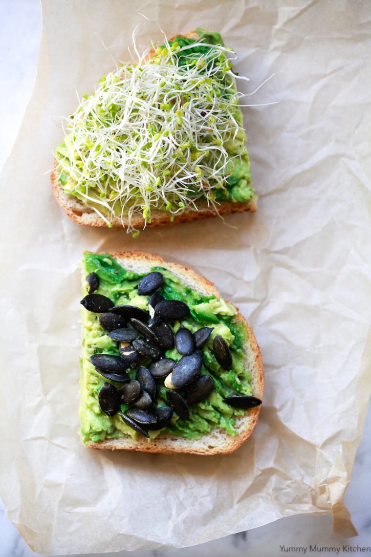 Avocado toast with pumpkin seeds and sprouts. 