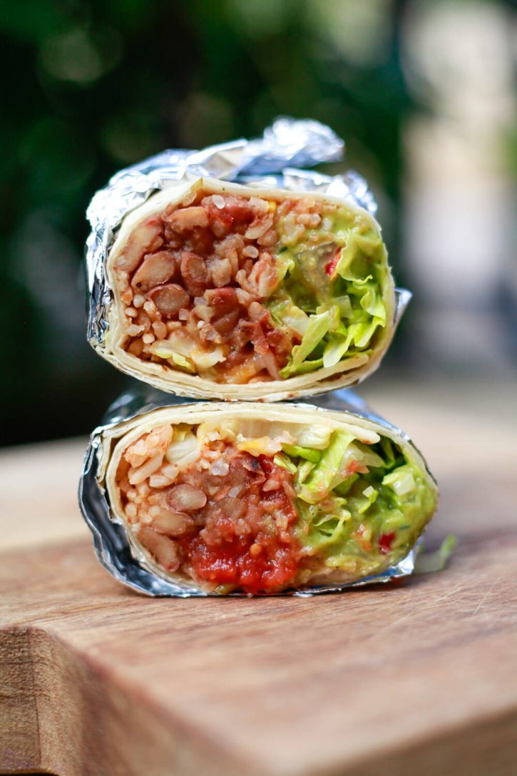 A vegan burrito made with pinto beans, rice, and guacamole. 