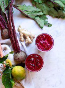 Two glasses of detox juice. This is a bright red purple beet juice recipe for cleanse and liver detox.