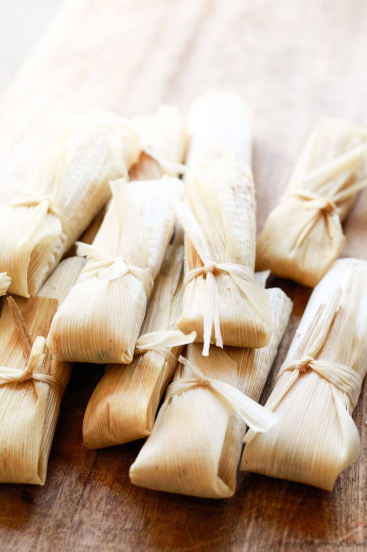 Beautiful vegetarian and vegan tamales are wrapped, tied, and ready to be steamed. 