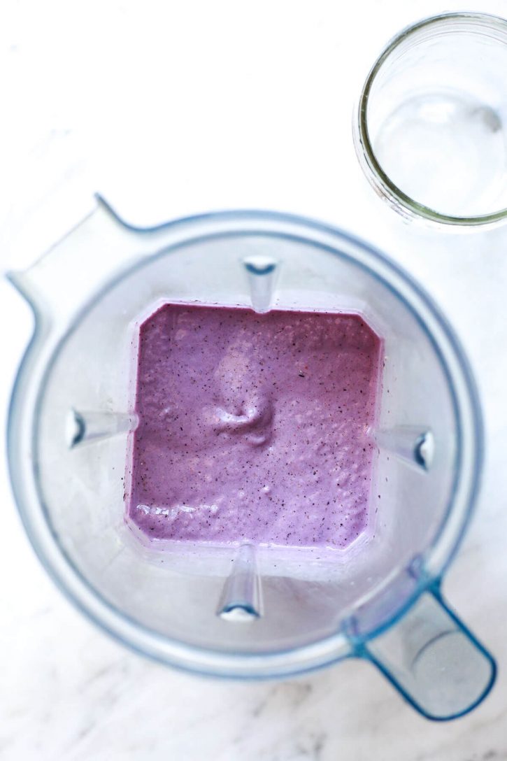 Purple blueberry banana smoothie just blended in a Vitamix blender. This healthy blueberry chia smoothie is so delicious. 