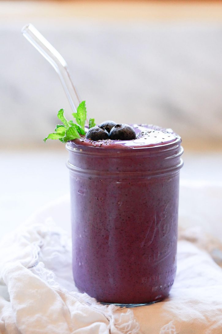 A healthy and delicious blueberry smoothie with banana, almond milk, chia, hemp seeds, and peanut or almond butter. The best creamy chia seed smoothie.