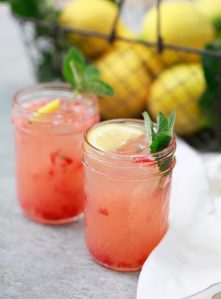 Two glasses filled with homemade strawberry pink lemonade.