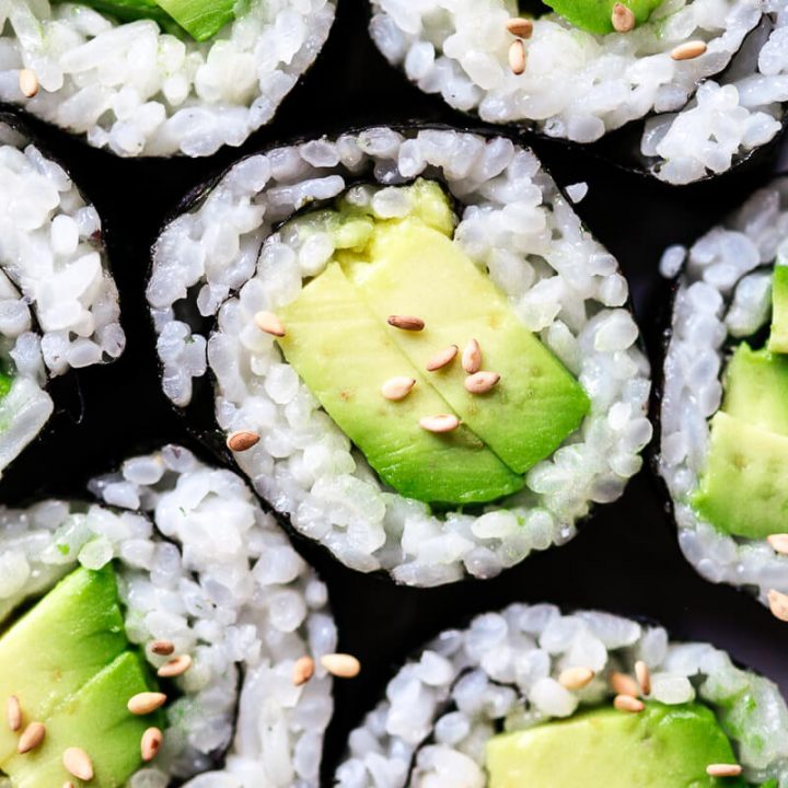 A close up photo of avocado sushi to show of perfect sushi rice made at home in the Instant Pot.