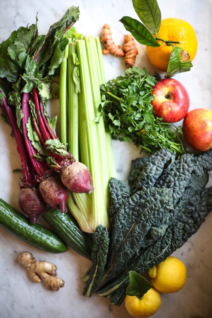 A beautiful photograph of fresh fruits and vegetables that are great for juicing recipes. 