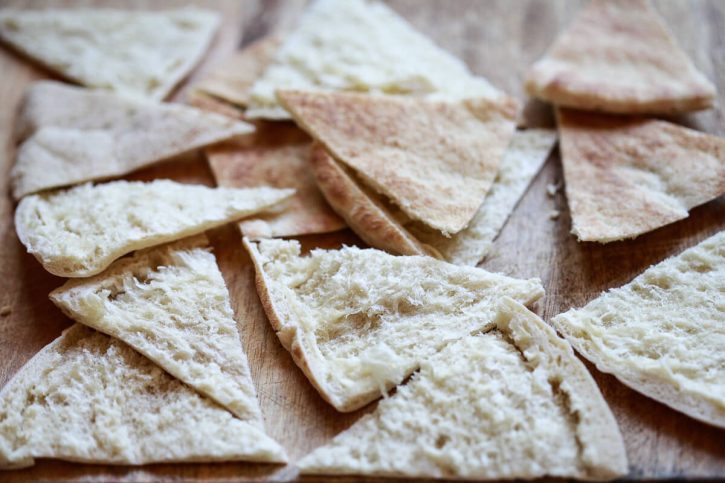 Pita bread triangles are ready to be baked or air fried to make homemade pita chips. 