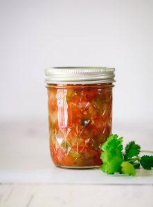One Ball jar filled with canned salsa.