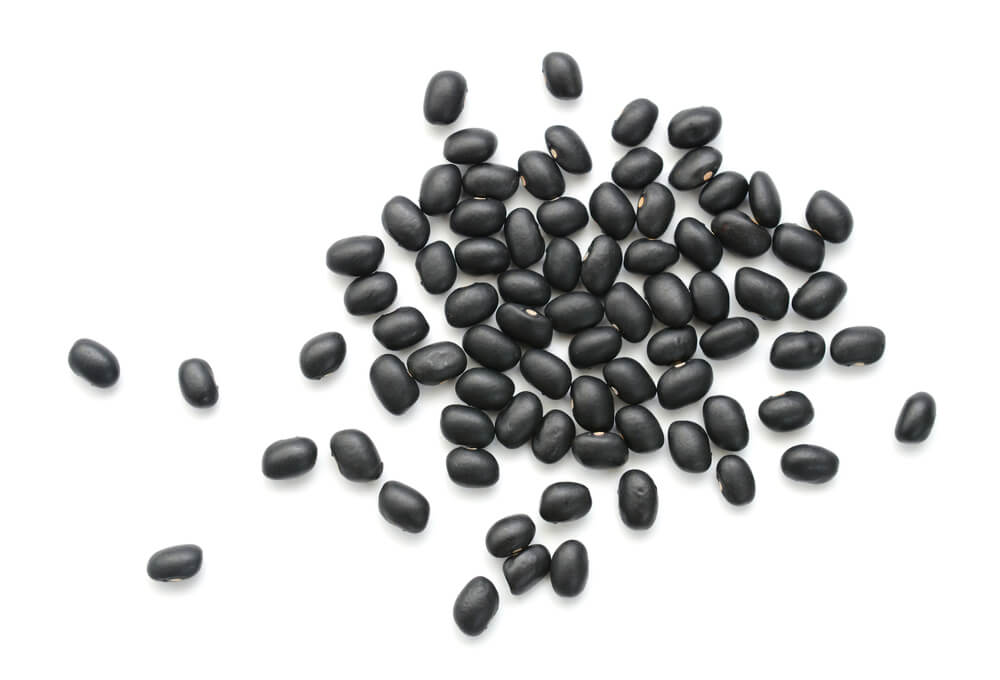 Close up photo of dried black beans. 