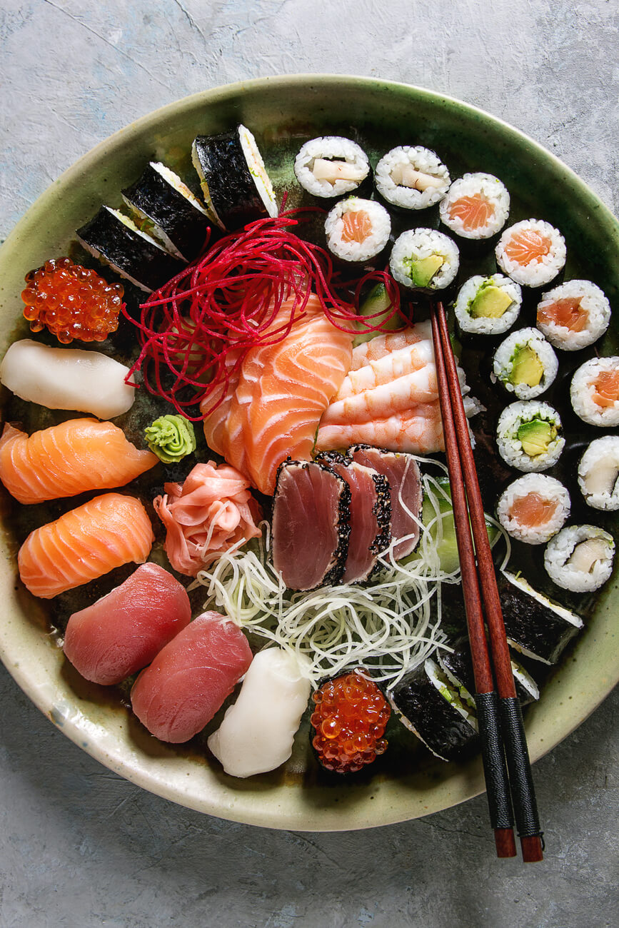 A beautiful platter with sushi, sashimi, and nigiri to show the differences. 
