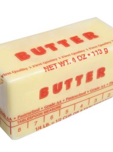A stick of butter with tablespoons shown on the wrapper.