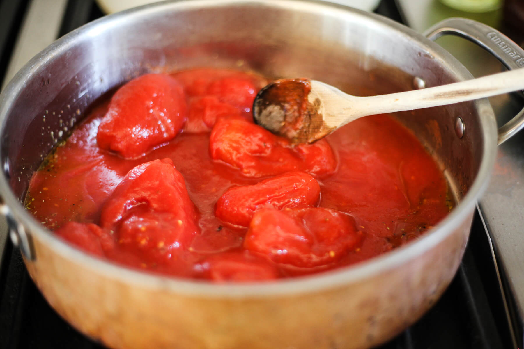 San Marzano tomatoes in a large skillet.