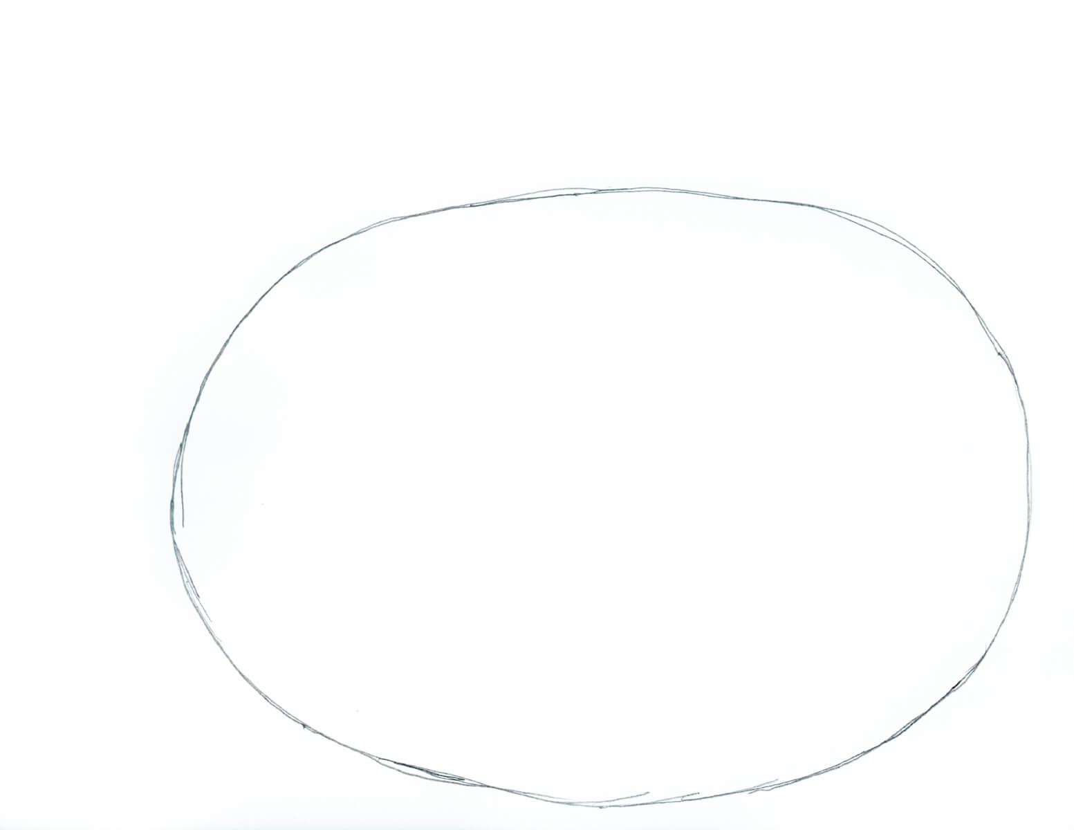 An oval on a piece of paper to start drawing a pumpkin.