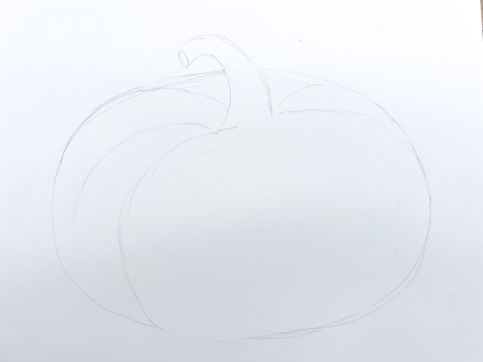 A light pencil on white paper sketch of how to draw a pumpkin. 