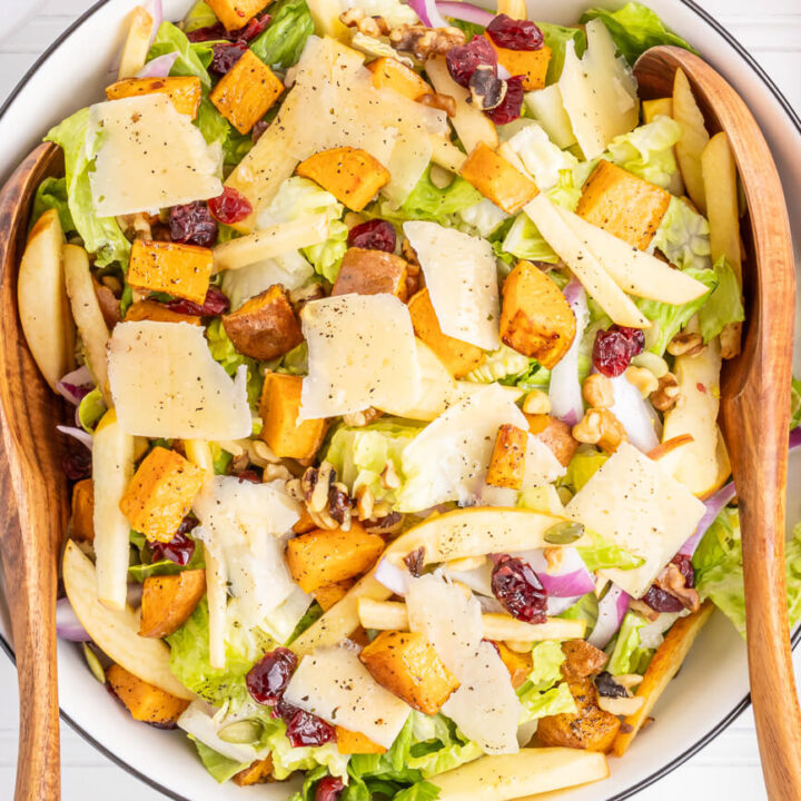 Fall salad with roasted sweet potatoes, apple, lettuce, cranberries, and Parmsan. A lovely Thanksgiving salad recipe.
