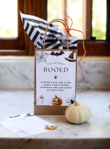A Halloween You've been booed bag on a marble kitchen counter.