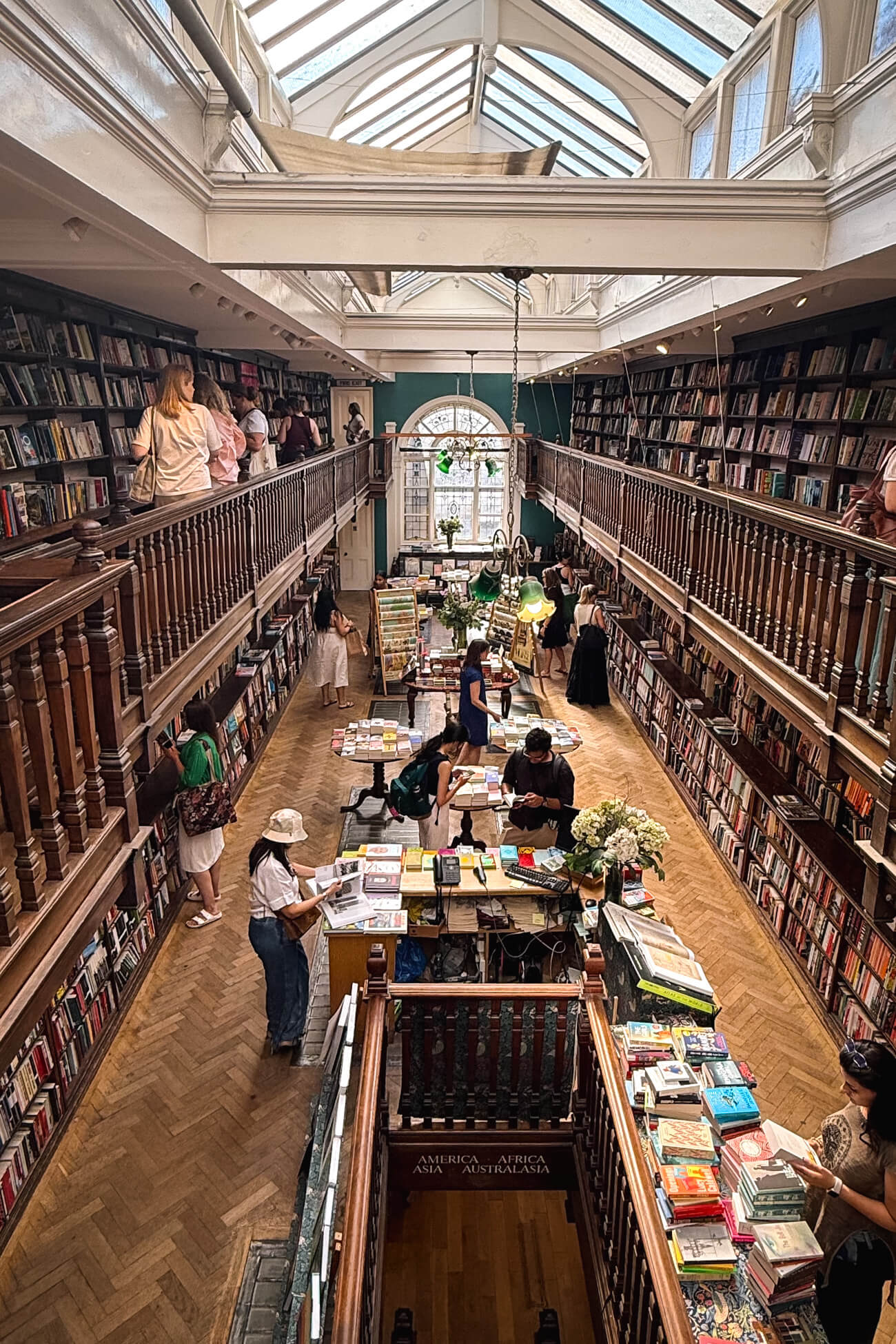 The inside of Daunt Bookstore in Marylebone London. A beautiful Edwardian style bookstore with oat galleries and skylights. One of the most beautiful bookstores in the world. 
