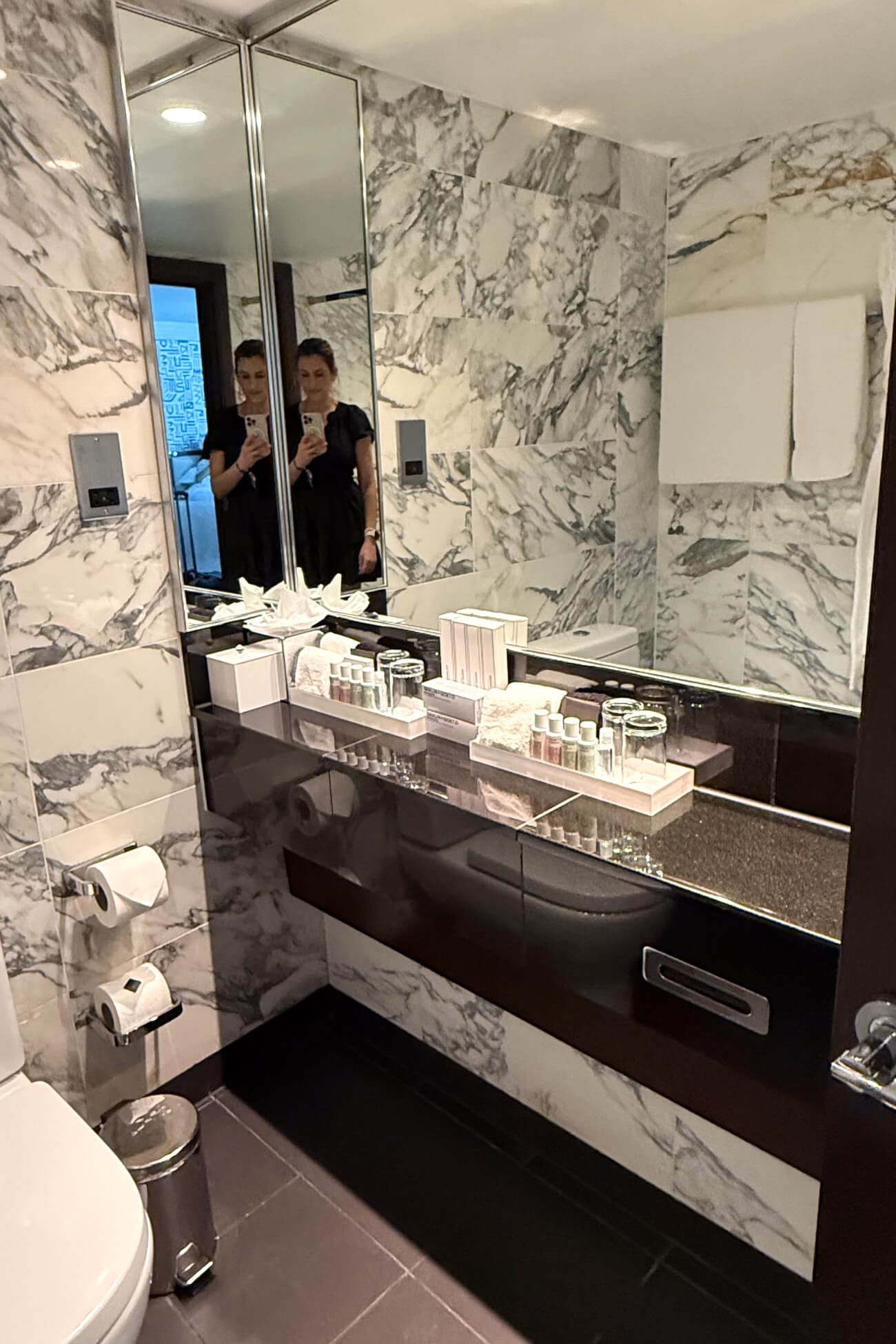 A marble bathroom shown as a Marylebone hotel review. 
