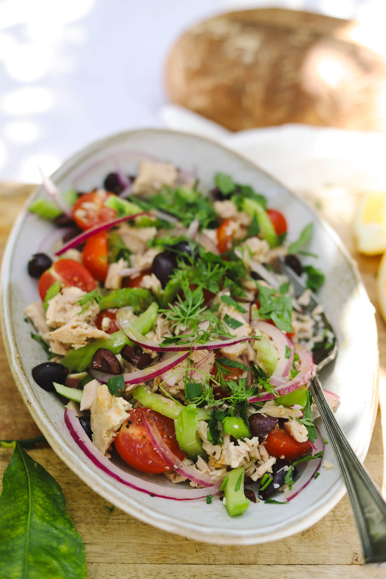 Mediterranean Tuna Salad with Sourdough Mediterranean tuna salad with albacore tuna, cherry tomatoes, kalamata olives, celery, red onion, and parsley served with crusty sourdough bread.