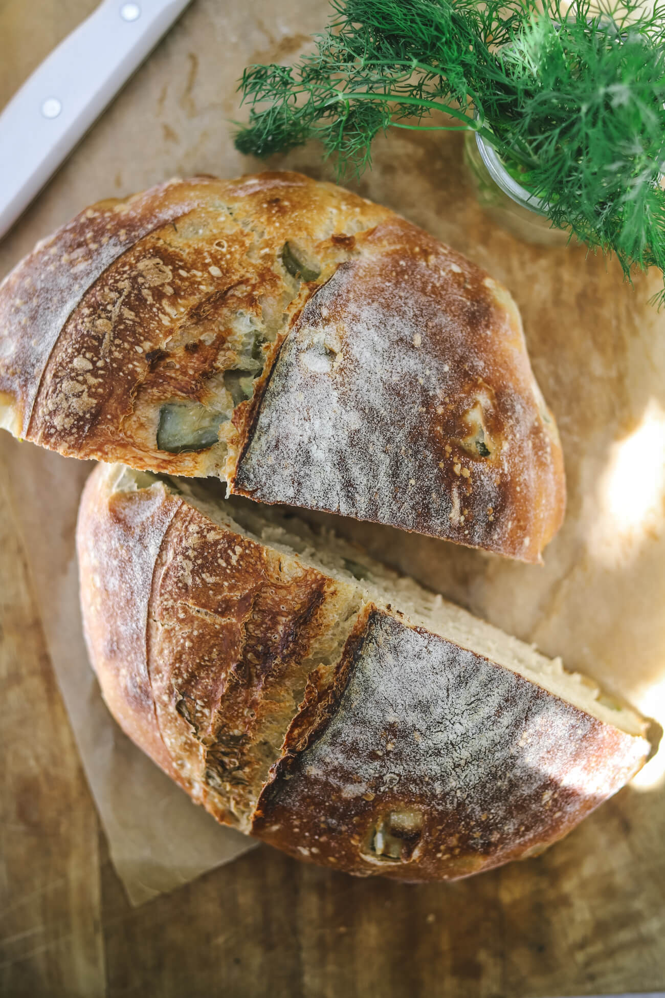 Sliced Dill Pickle Sourdough Bread Dill pickle sourdough bread sliced open with visible pickle pieces and fresh dill