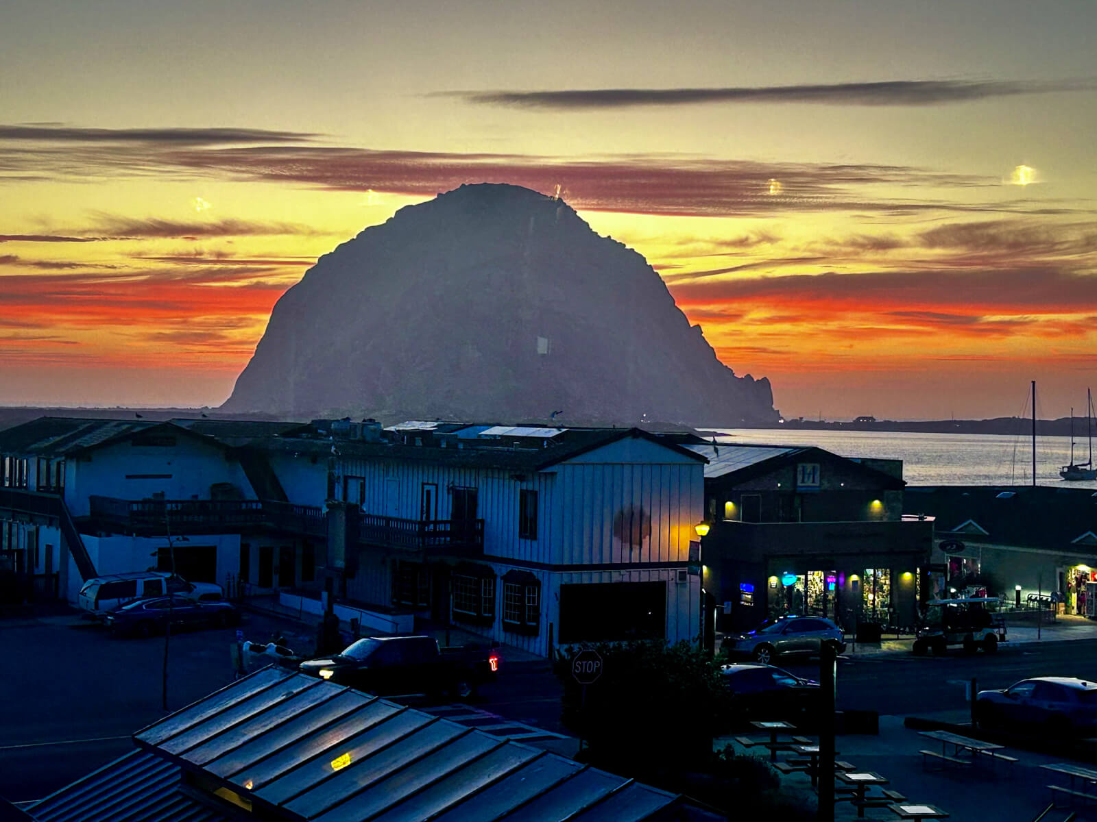 Morro Rock Sunset View from Let’s Get Tuned Sunset over Morro Rock and the Embarcadero viewed from Let’s Get Tuned in Morro Bay, California
