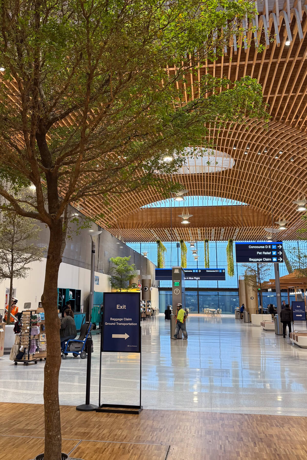 Portland Airport Arrival The inside of the Portland Oregon airport with trees.